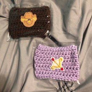 2 knitted cup cozies.